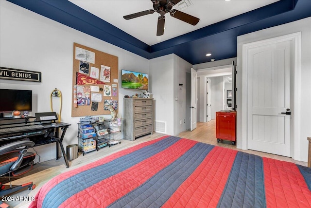 bedroom with wood-type flooring and ceiling fan