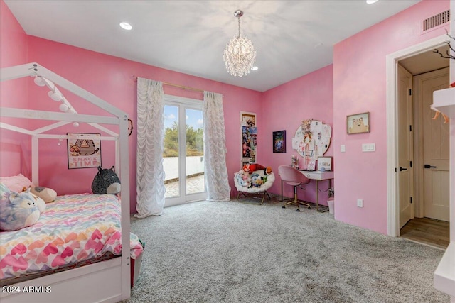 carpeted bedroom with an inviting chandelier and access to exterior