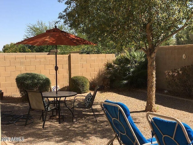 view of patio / terrace with outdoor dining area and a fenced backyard