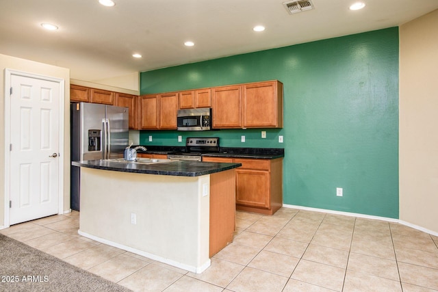 kitchen featuring light tile patterned flooring, recessed lighting, visible vents, and stainless steel appliances