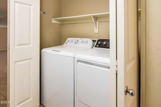 laundry room with laundry area and washing machine and clothes dryer
