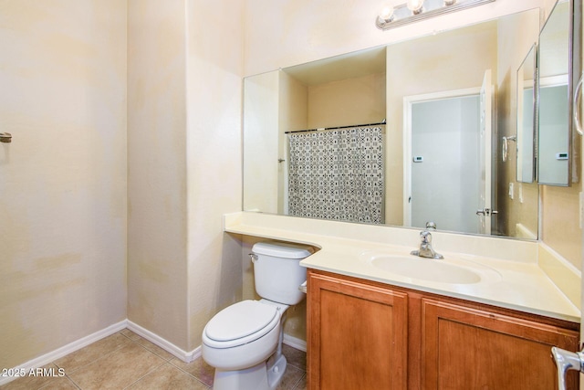 bathroom with vanity, baseboards, tile patterned flooring, curtained shower, and toilet