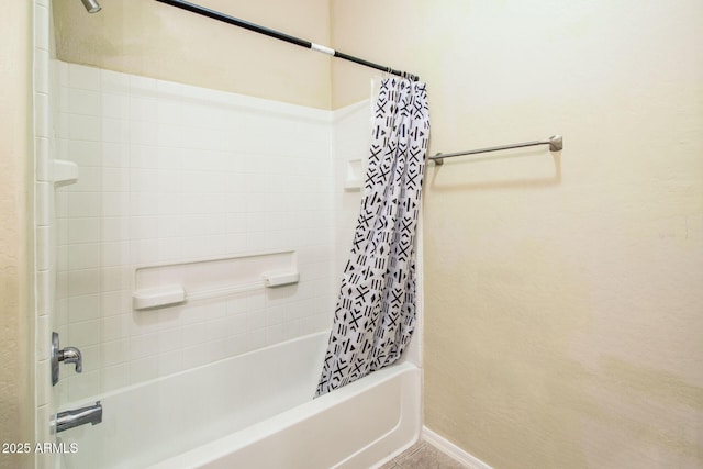 bathroom with shower / bath combo