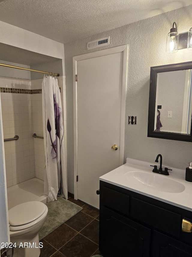 bathroom featuring vanity, a textured ceiling, tile patterned flooring, toilet, and curtained shower