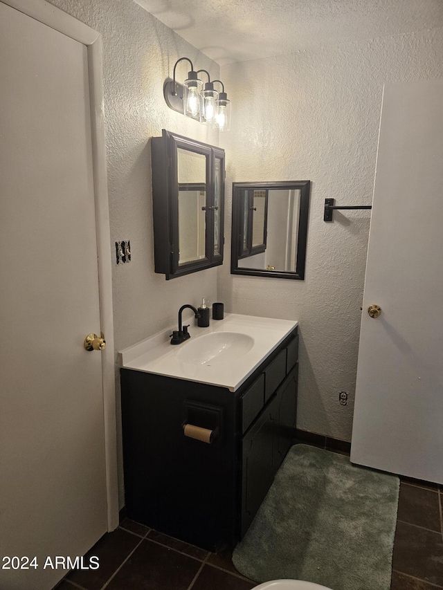 bathroom with vanity and tile patterned floors