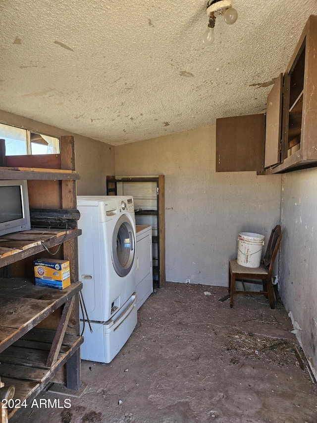 clothes washing area with separate washer and dryer