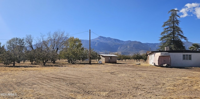 mountain view featuring a rural view