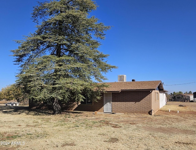 view of side of home featuring cooling unit