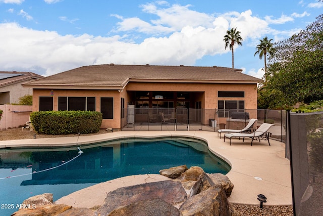 view of swimming pool with a patio