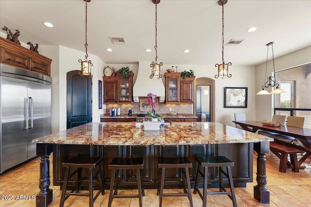 28025 N 156th Pl, Scottsdale, AZ 85262 - kitchen featuring stainless steel built in refrigerator, custom range hood, arched walkways, a large island, and recessed lighting