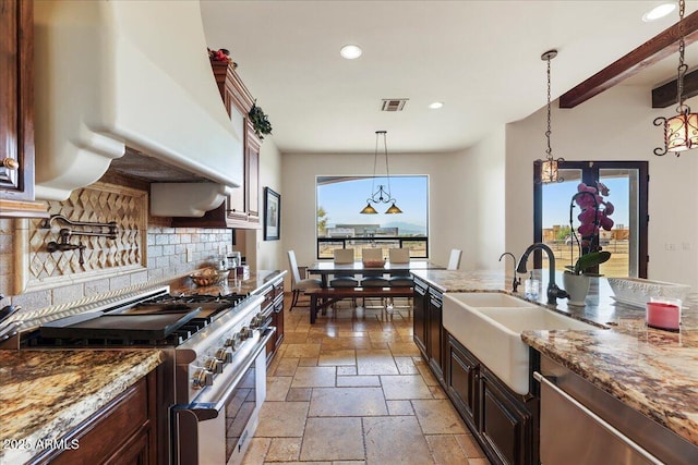 28025 N 156th Pl, Scottsdale, AZ 85262 - kitchen featuring stainless steel appliances, a sink, stone tile floors, extractor fan, and tasteful backsplash