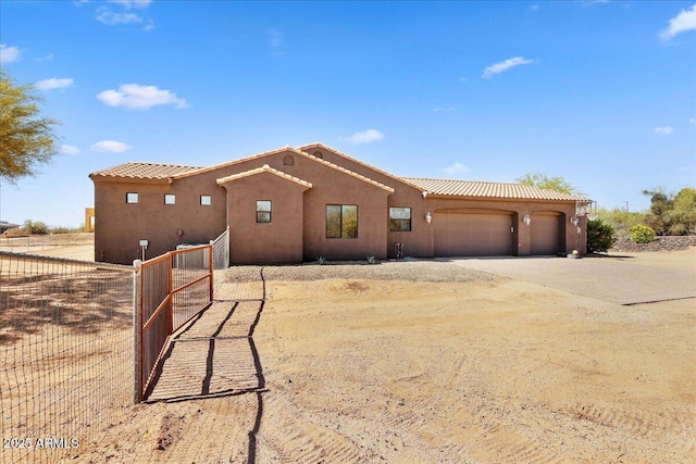 28025 N 156th Pl, Scottsdale, AZ 85262 - view of front facade with dirt driveway, a garage, and stucco siding