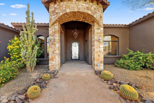 28025 N 156th Pl, Scottsdale, AZ 85262 - view of exterior entry featuring stucco siding, stone siding, and a tiled roof
