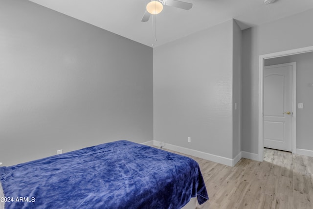 bedroom with light wood-type flooring and ceiling fan