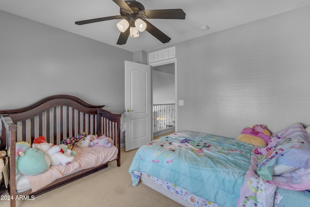 carpeted bedroom featuring ceiling fan