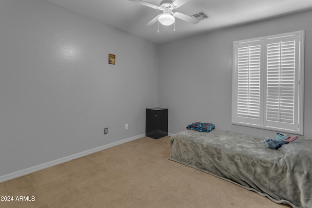 carpeted bedroom with ceiling fan