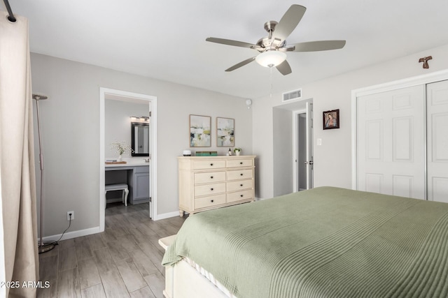 bedroom with a closet, visible vents, a ceiling fan, light wood-type flooring, and baseboards