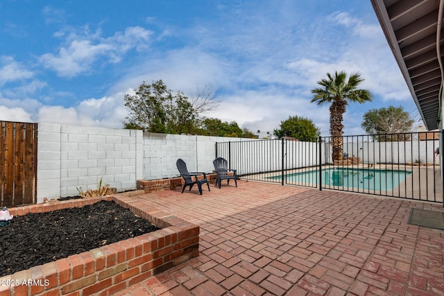 view of patio with a fenced backyard and a fenced in pool