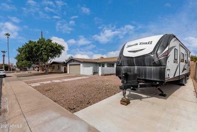 view of front of house with a garage and concrete driveway