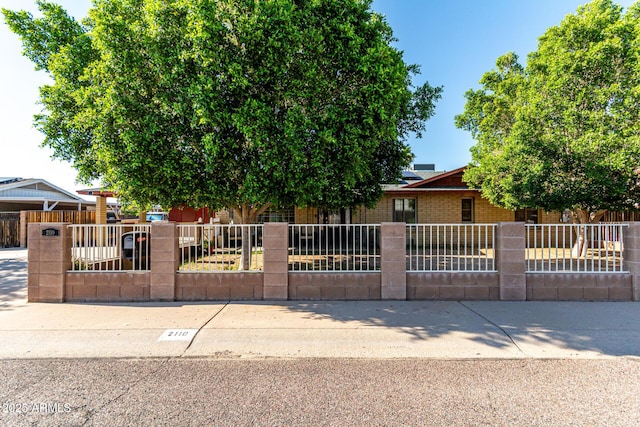 2110 W Morrow Dr, Phoenix, AZ 85027 - obstructed view of property featuring a fenced front yard and brick siding