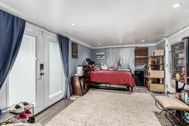 2110 W Morrow Dr, Phoenix, AZ 85027 - bedroom featuring light wood-style floors, ornamental molding, and recessed lighting