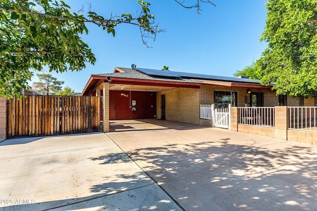 2110 W Morrow Dr, Phoenix, AZ 85027 - single story home with a gate, driveway, solar panels, and an attached carport