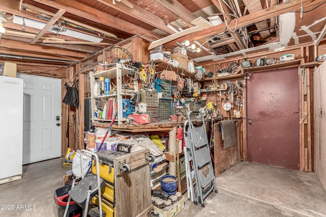 2110 W Morrow Dr, Phoenix, AZ 85027 - unfinished below grade area with freestanding refrigerator and a workshop area