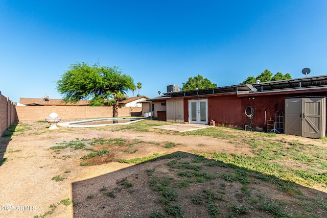 2110 W Morrow Dr, Phoenix, AZ 85027 - fenced backyard featuring french doors and a patio area