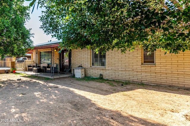 2110 W Morrow Dr, Phoenix, AZ 85027 - view of front of home with a gate, a patio, and brick siding