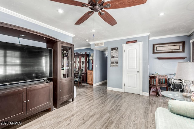 2110 W Morrow Dr, Phoenix, AZ 85027 - living area featuring a ceiling fan, ornamental molding, baseboards, light wood-type flooring, and recessed lighting