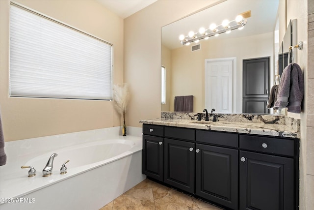 full bathroom with a garden tub and vanity