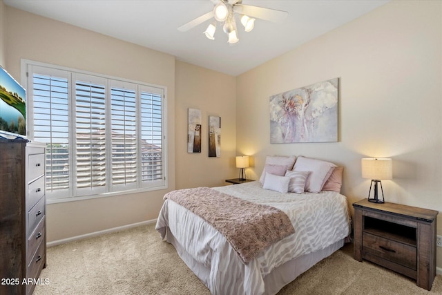 bedroom featuring carpet, baseboards, and a ceiling fan
