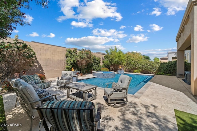 view of swimming pool with an outdoor living space, a patio, and a pool with connected hot tub