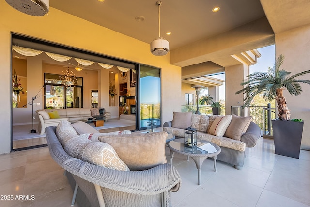 view of patio with a balcony and outdoor lounge area