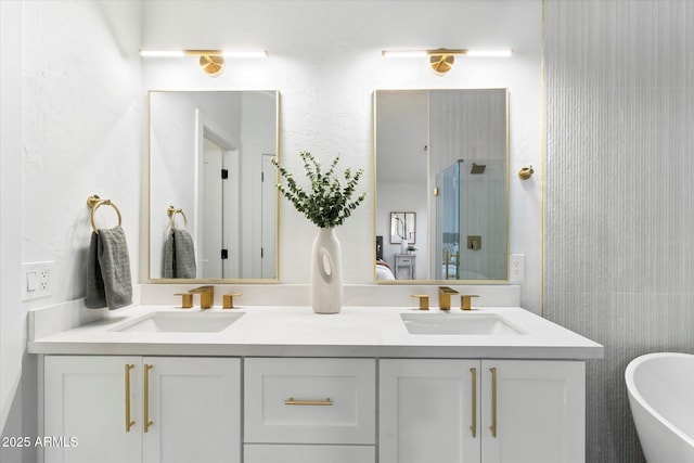 bathroom featuring vanity and shower with separate bathtub