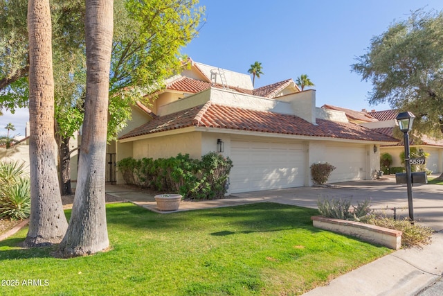 view of front of home featuring a front lawn and a garage