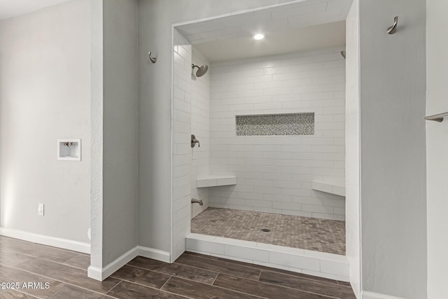 bathroom featuring a tile shower