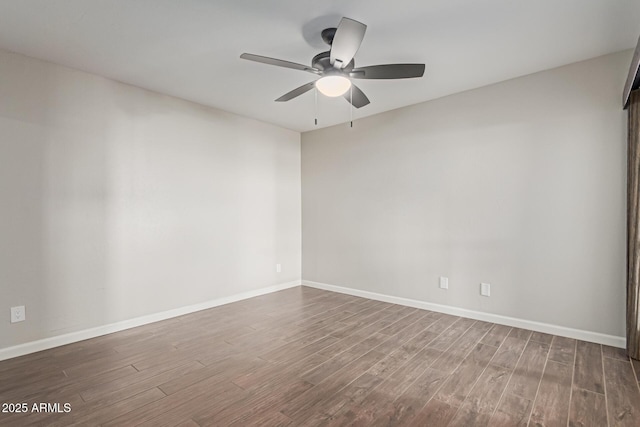 empty room with hardwood / wood-style flooring and ceiling fan