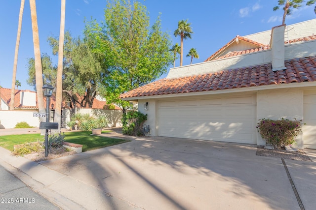 view of side of home featuring a garage