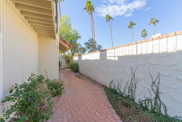 view of side of property featuring a patio area