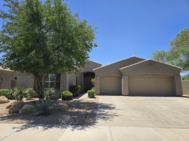 18359 W Sweet Acacia Dr, Goodyear, AZ 85338 - adobe home featuring an attached garage, concrete driveway, and stucco siding