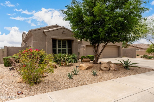 18359 W Sweet Acacia Dr, Goodyear, AZ 85338 - view of front of property featuring stucco siding, driveway, a garage, and fence