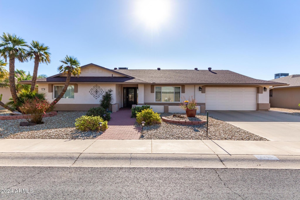 ranch-style home with a garage