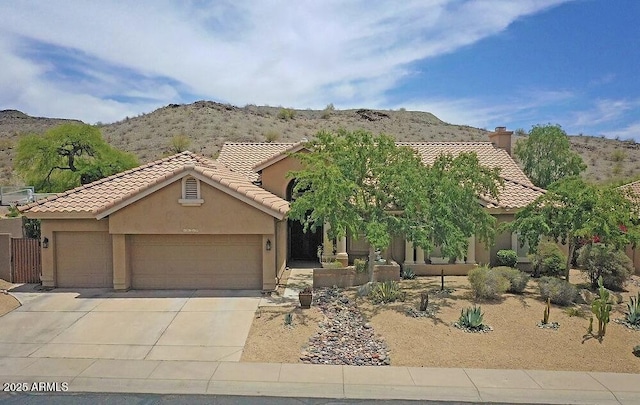 16219 S 14th Way, Phoenix, AZ 85048 - view of front of home with a mountain view, an attached garage, driveway, a tile roof, and stucco siding