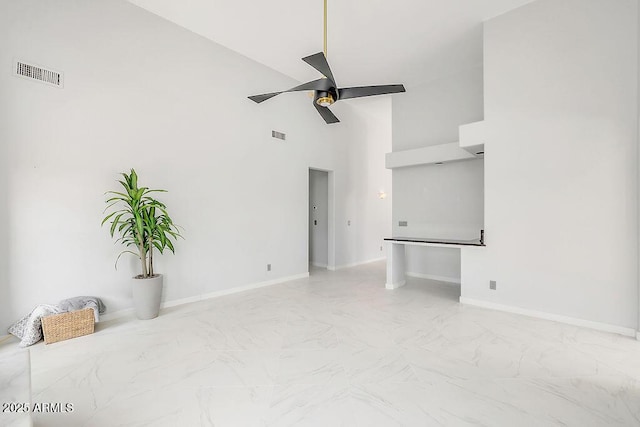 16219 S 14th Way, Phoenix, AZ 85048 - unfurnished room with a ceiling fan, high vaulted ceiling, marble finish floors, and baseboards