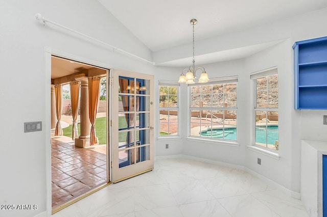 16219 S 14th Way, Phoenix, AZ 85048 - unfurnished dining area featuring vaulted ceiling, a chandelier, plenty of natural light, and marble look tile flooring