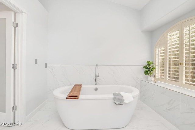 16219 S 14th Way, Phoenix, AZ 85048 - full bath with marble finish flooring, a freestanding bath, and tile walls