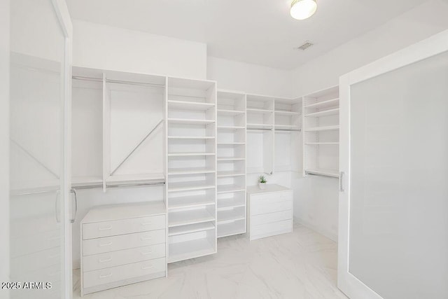 16219 S 14th Way, Phoenix, AZ 85048 - walk in closet featuring light marble finish floors