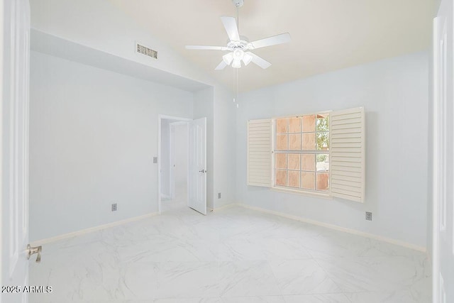 16219 S 14th Way, Phoenix, AZ 85048 - empty room with marble finish floors, ceiling fan, baseboards, and vaulted ceiling