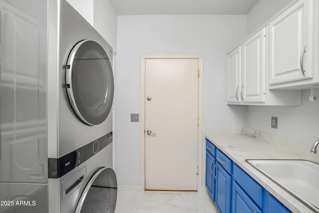 16219 S 14th Way, Phoenix, AZ 85048 - washroom with estacked washer and dryer, a sink, and light marble finish flooring